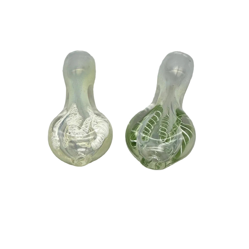 Two glass smoking accessories on a gray background