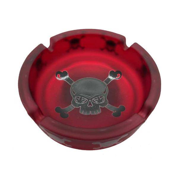 Red ashtray with black skull and leaf eyes