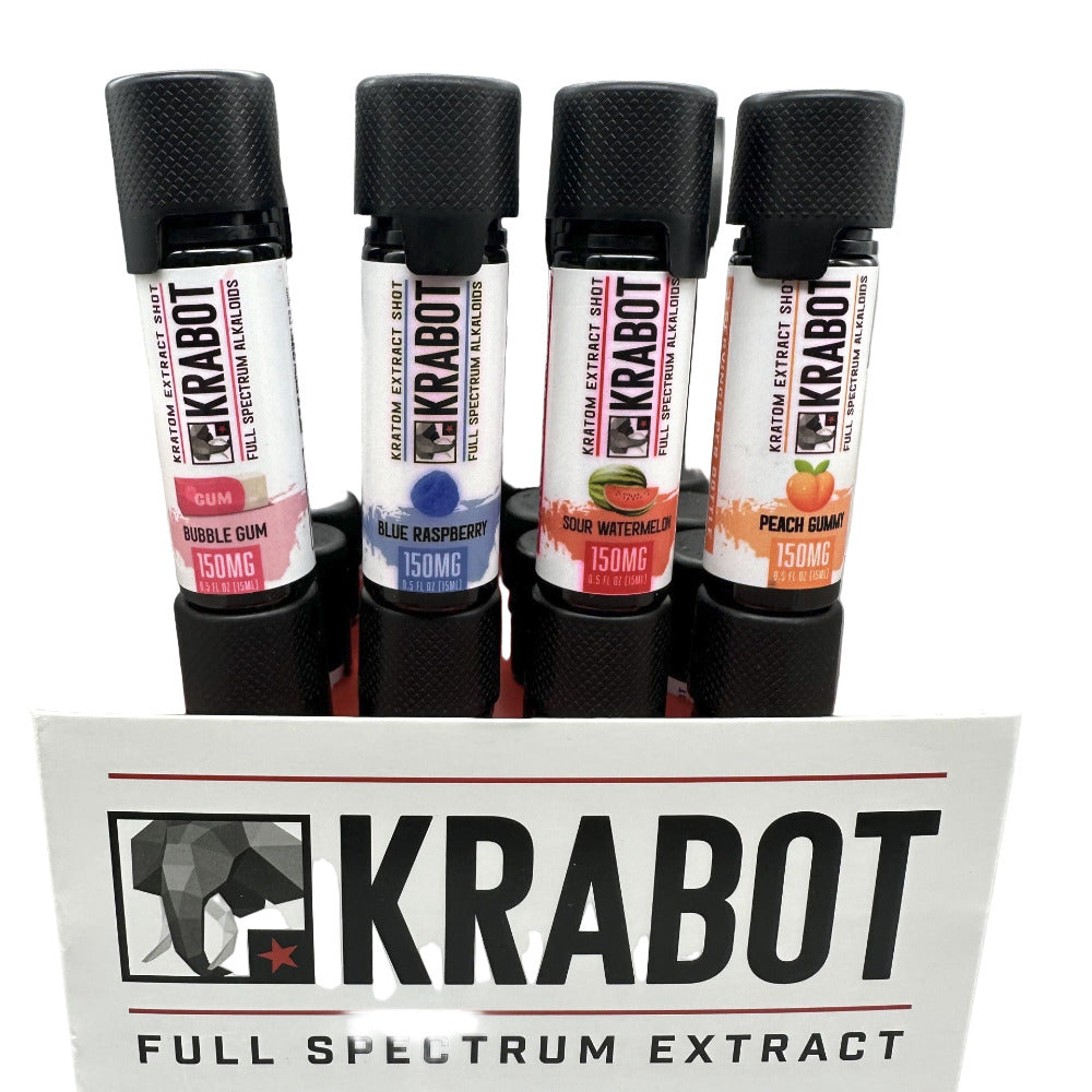 Four bottles of Krabot full spectrum extract with different flavors on a white stand.