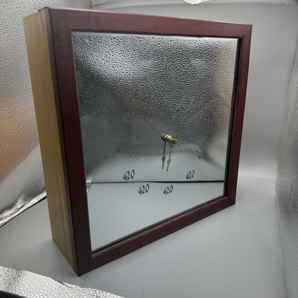 Decorative mirror with a wooden frame on a textured surface