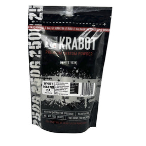 Black packaging of KRABOT Premium Kratom Powder on a gray background