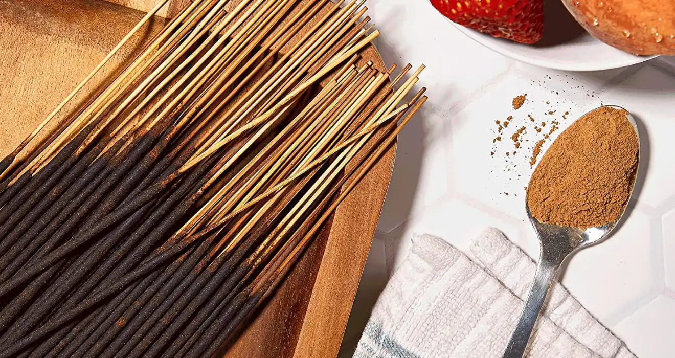 Incense sticks with cinnamon powder.