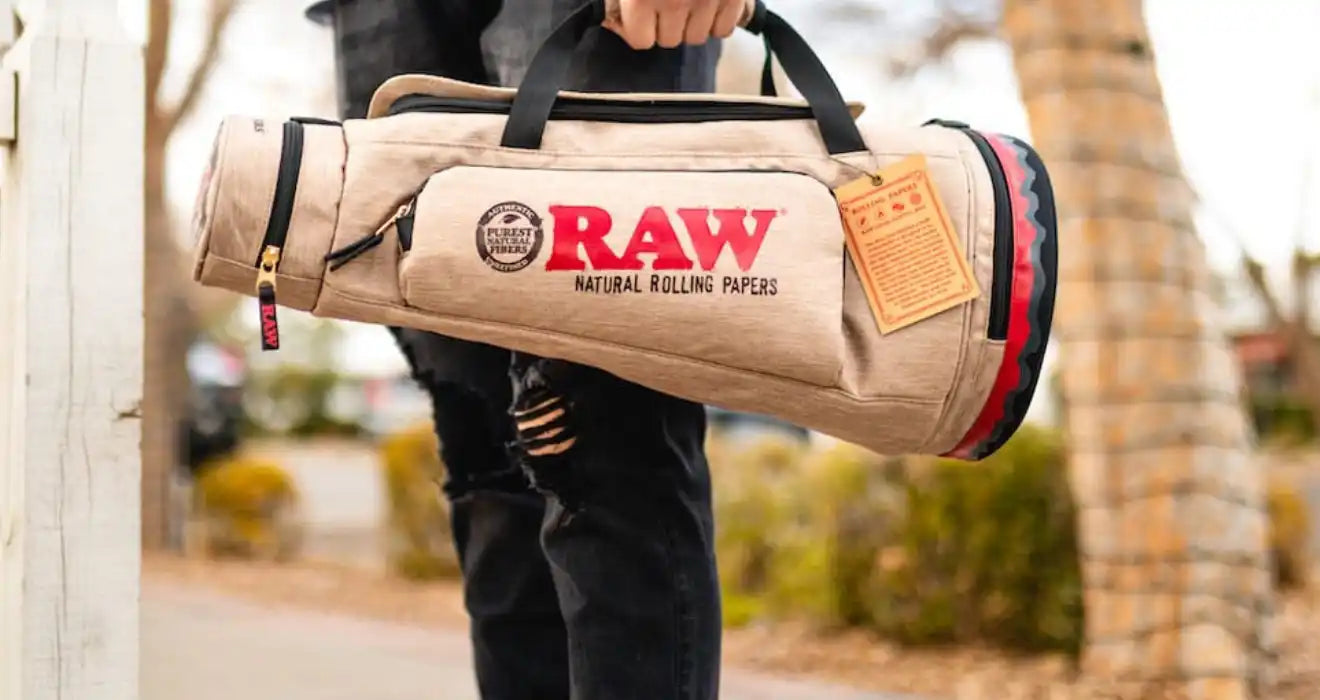 Tan RAW rolling papers duffel bag.